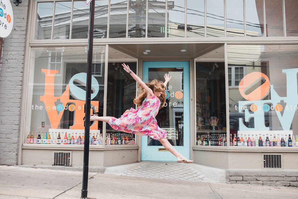 teen girl dancing in downtown street, family photographer in charlottesville virginia