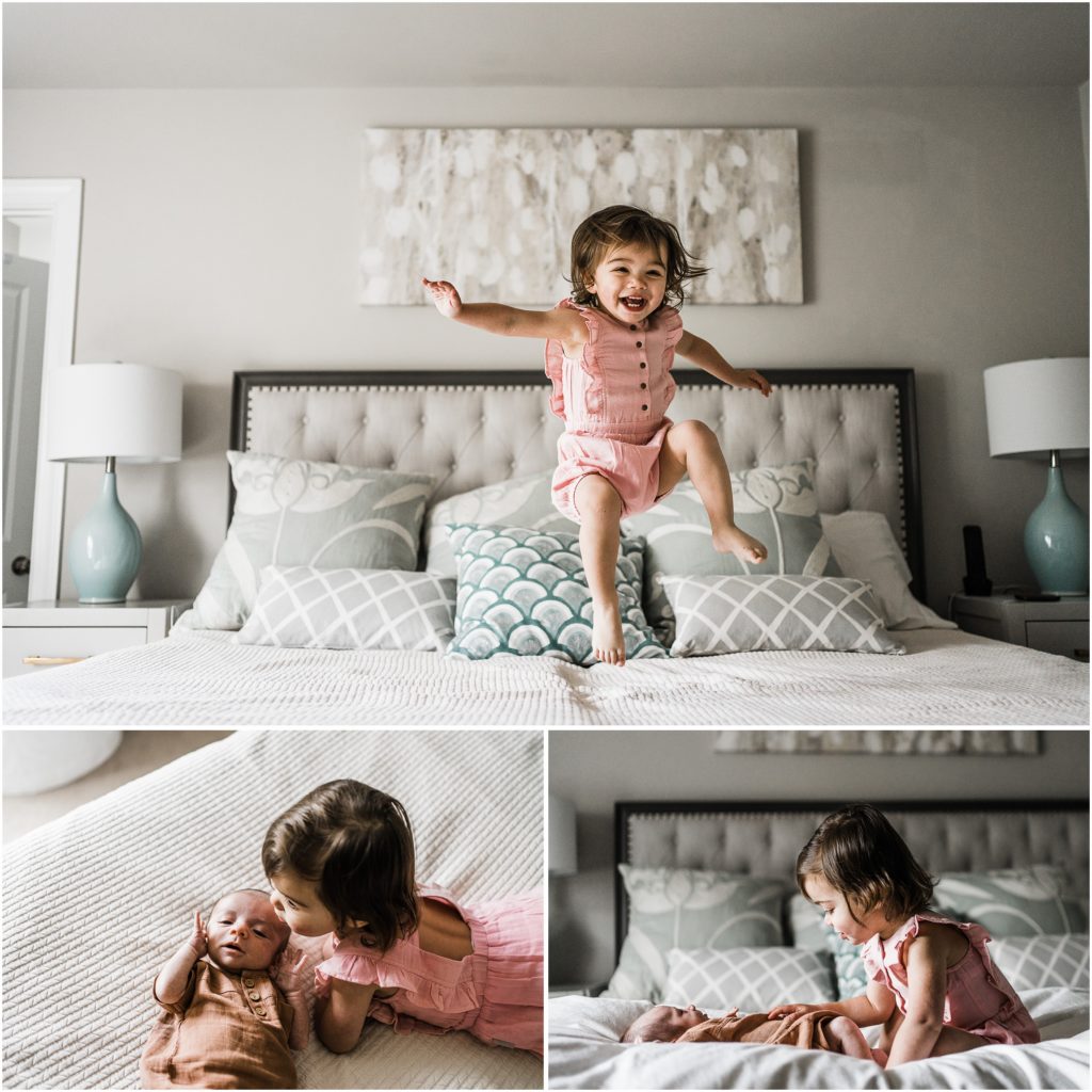 newborn photographer in charlottesville, at home with sibling on bed