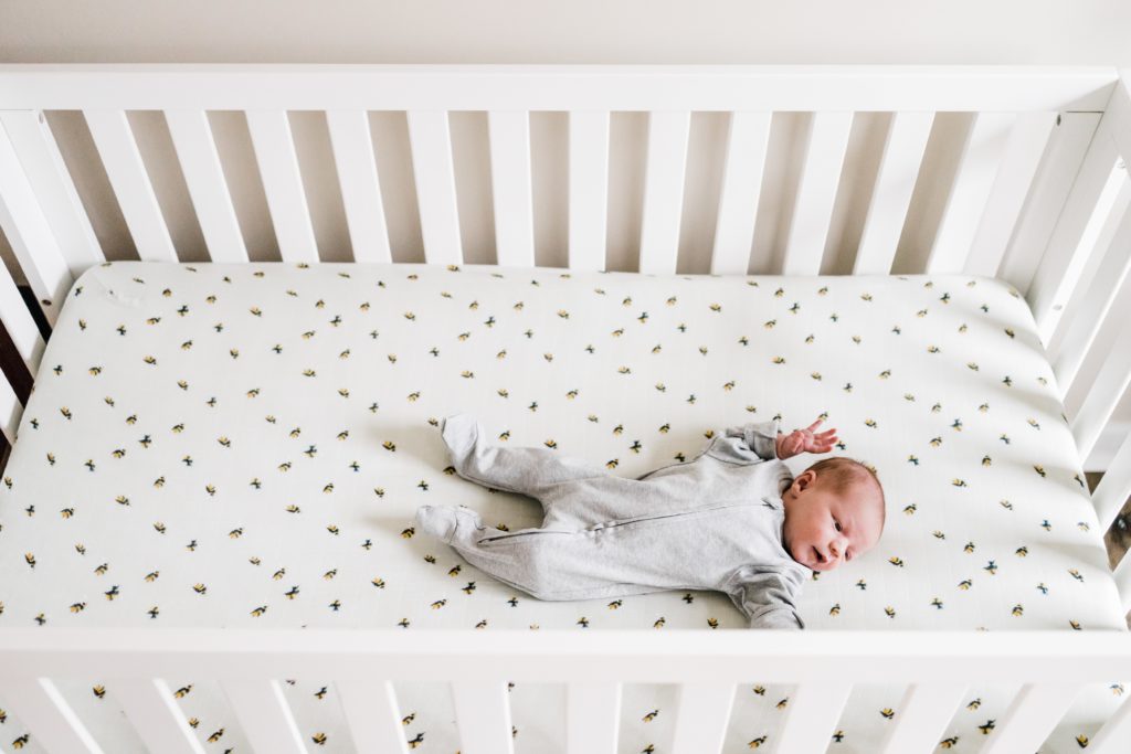 overhead crib shot for lifestyle newborn photos at home with charlottesville photographer