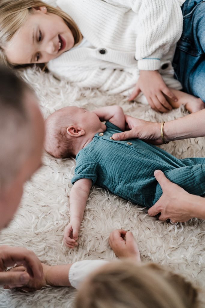 sibling poses in lifestyle newborn photos with charlottesville photographer